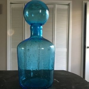 Decorative blue glass bottle with lid